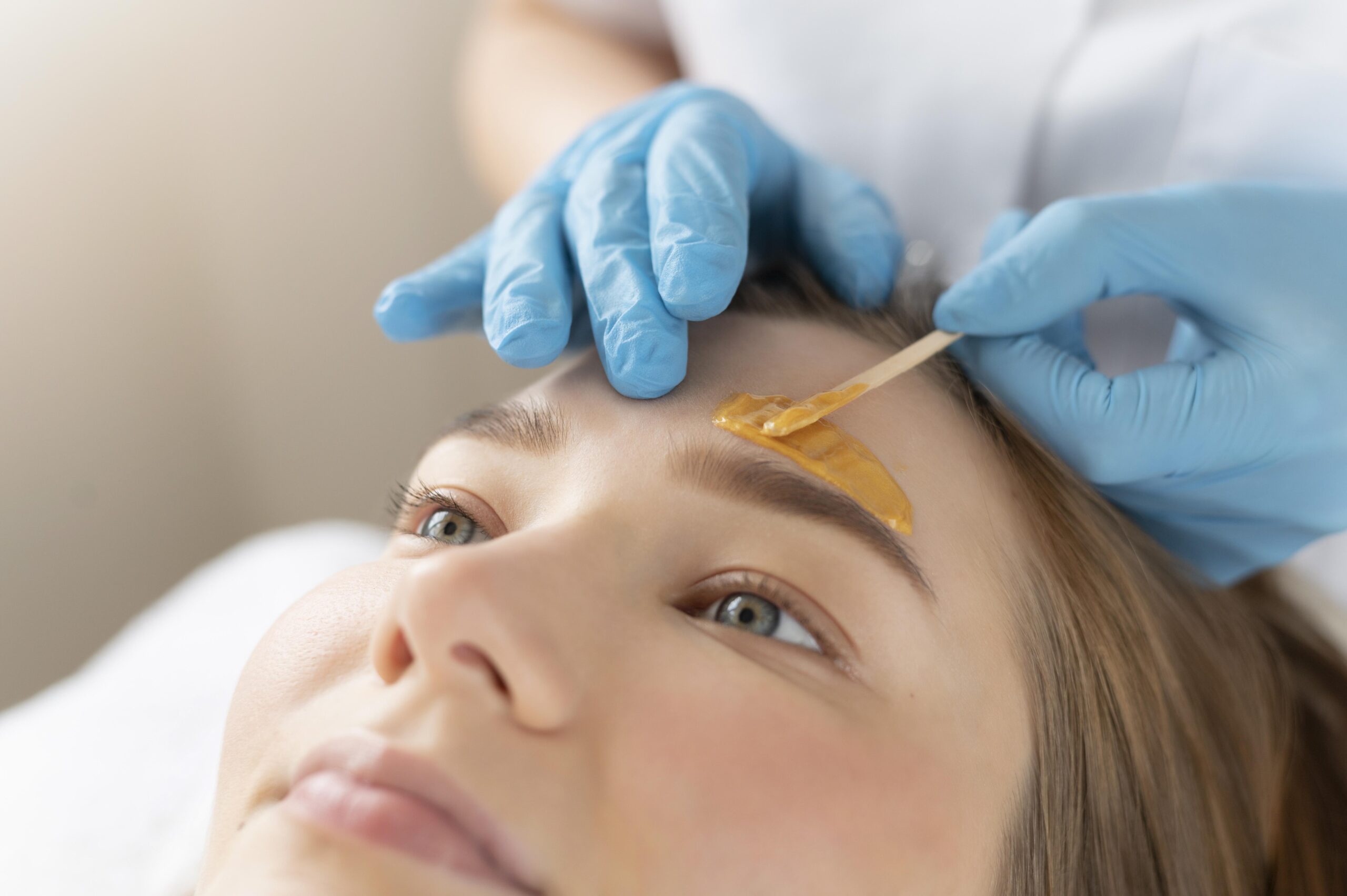 Client having an eyebrow treatment at a beauty salon near Horsell, Woking