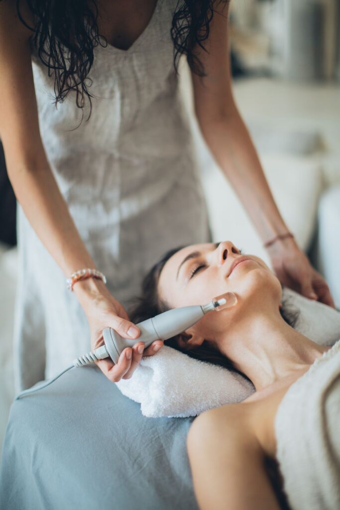 Hydra facial treatment being performed on a client