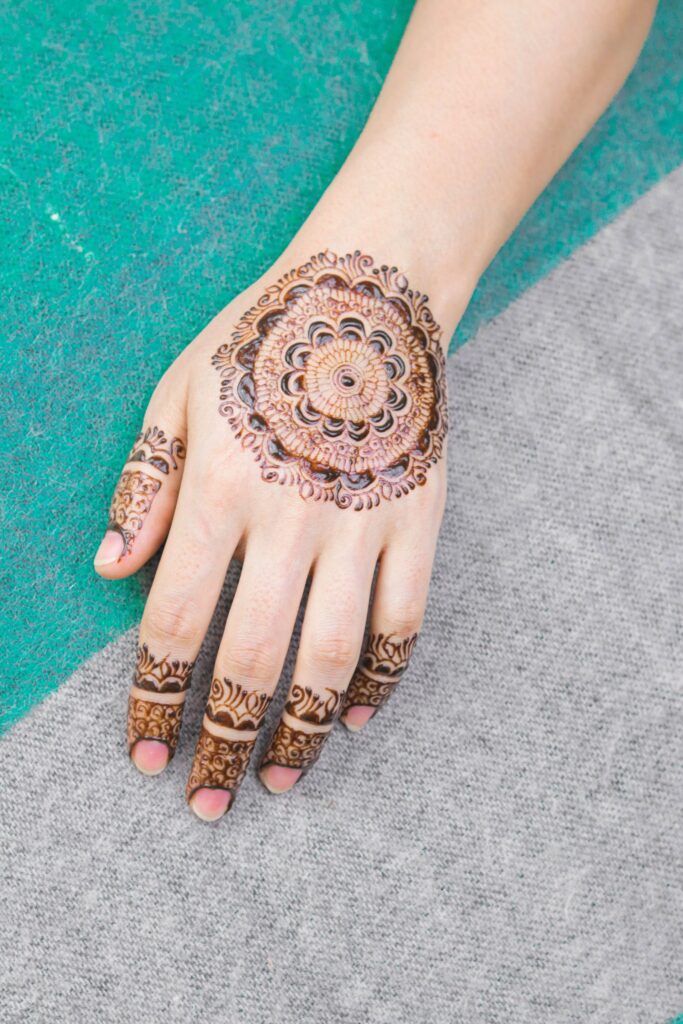 Simple mehndi design on the back of a hand